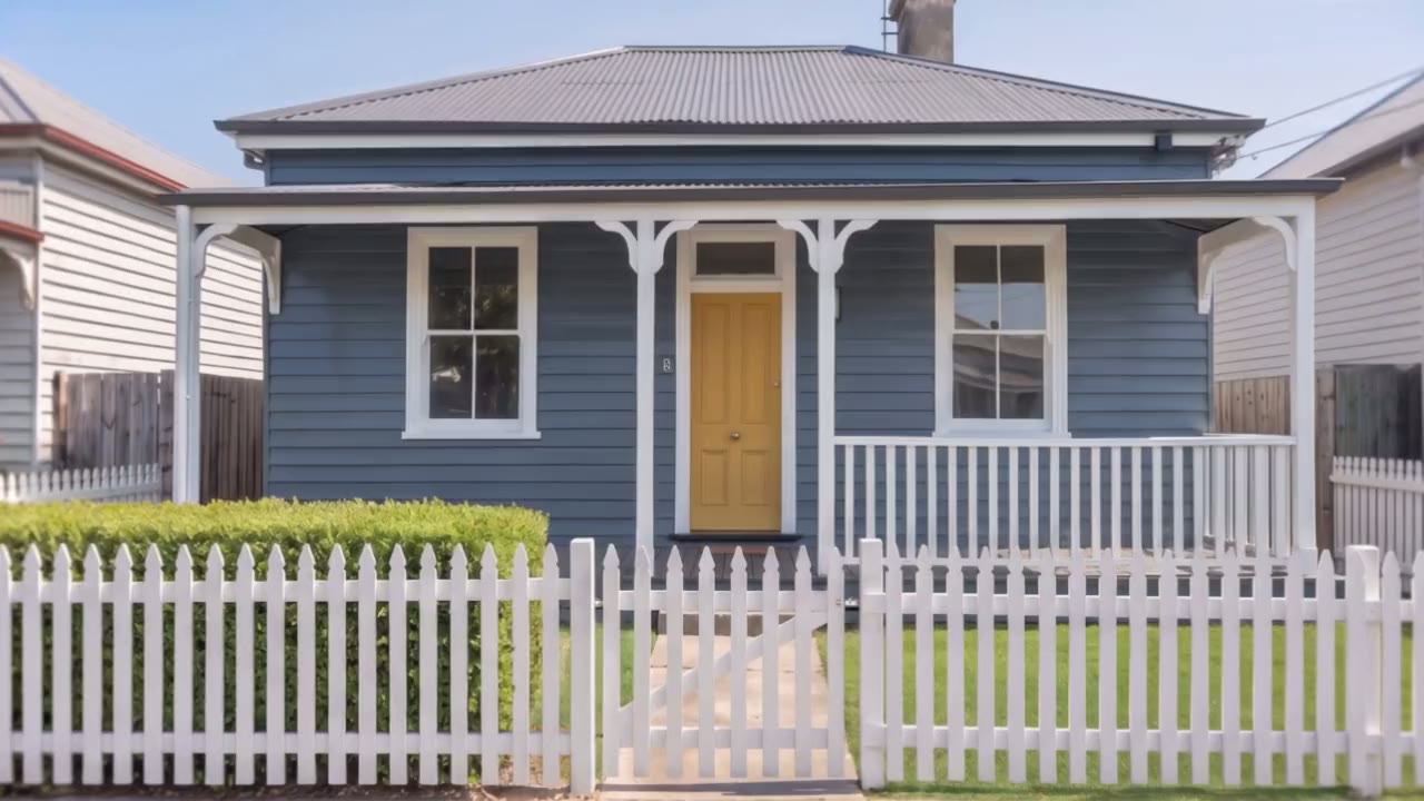The same weatherboard house, freshly finished by Two Coats Painting Co.
